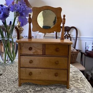 Vintage miniature dresser. Glass mirror.         Three fully functional drawers.